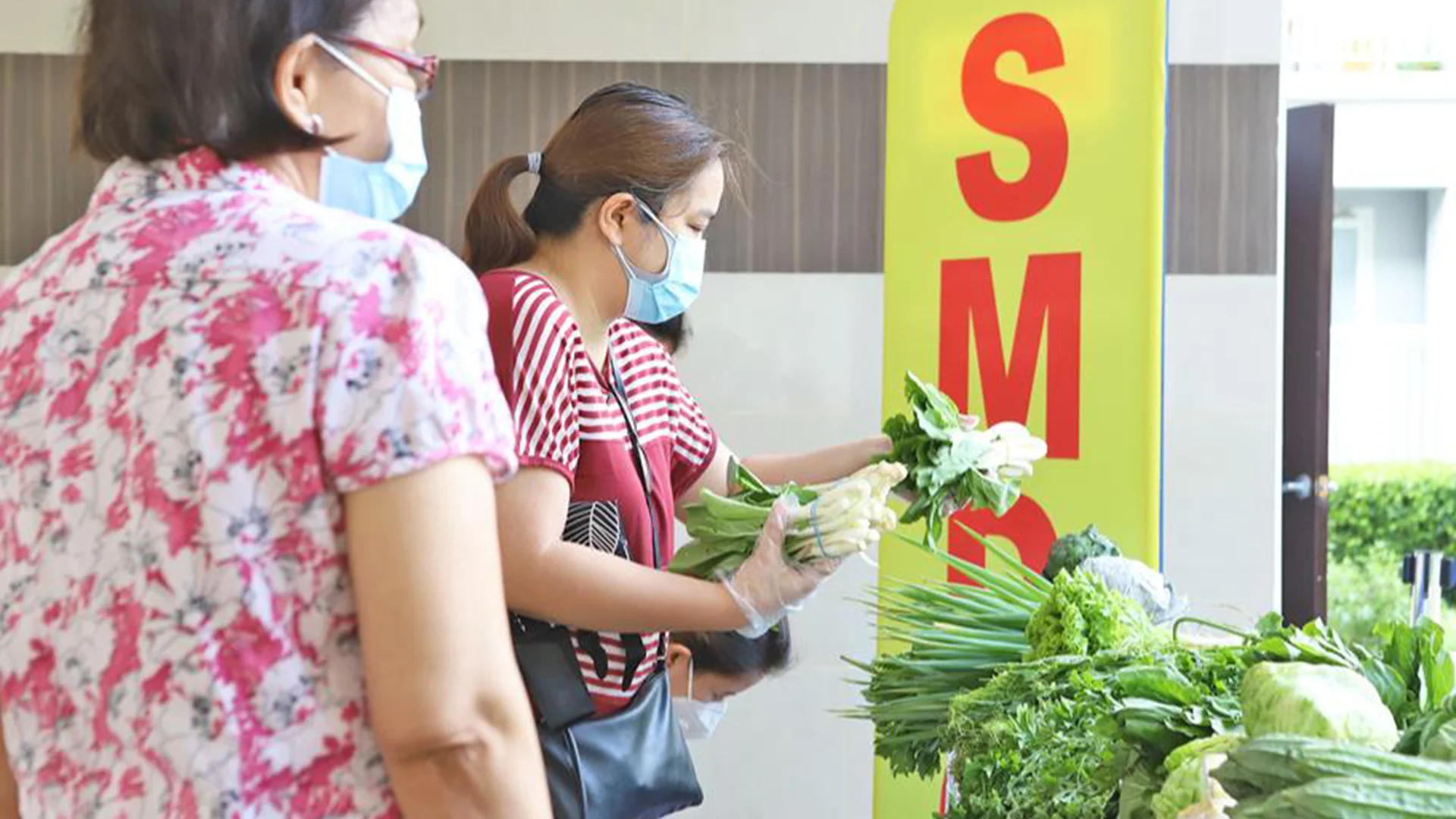 Residents buying fresh produce at the weekend market, without the need to leave their community