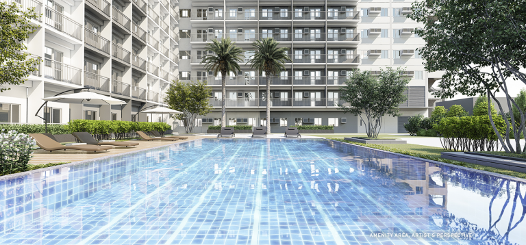 outdoor pool enclosed by buildings in SMDC Smile Residences