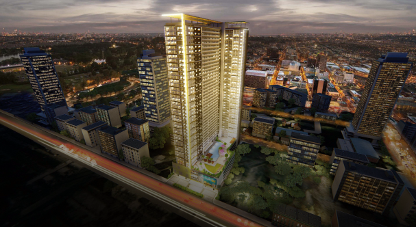 tall lighted building along the skyline aerial view of SMDC Glam Residences