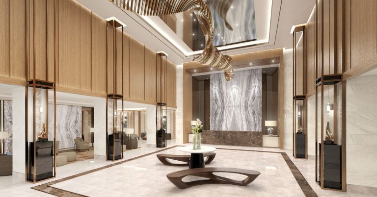 A spacious and elegantly designed lobby area at Sail Residences, featuring modern furnishings, abundant natural light, and contemporary decor elements. The lobby exudes sophistication and welcomes residents and guests with its inviting ambiance.