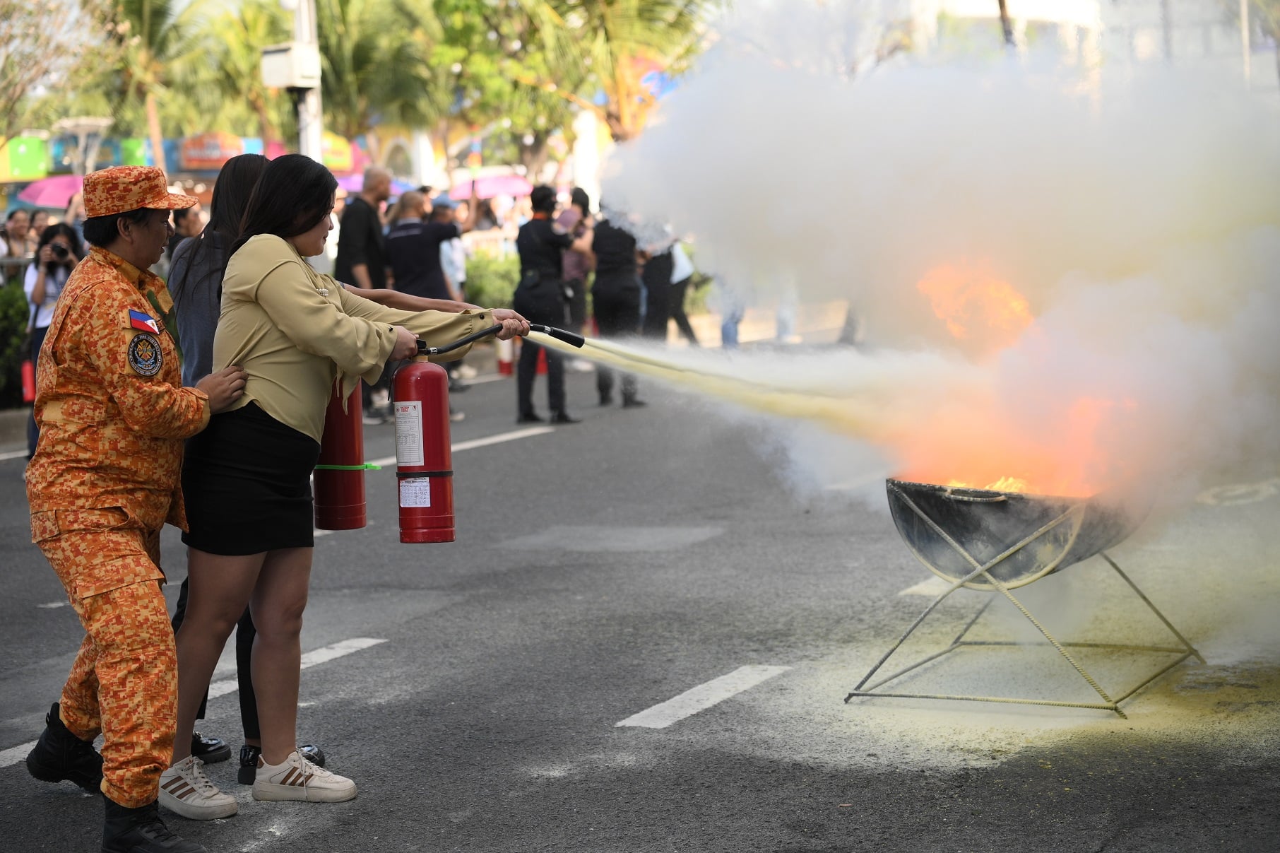 Female firefighters lead the 4th SM & BFP Nationwide Simultaneous Fire Drill, demonstrating their strength and resilience in fire prevention and disaster response. 